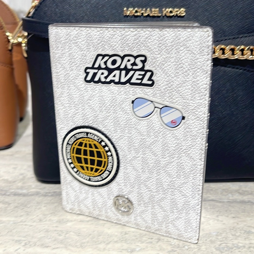 Michael Kors Jet Set Travel Md Embellished Signature Logo Passport Case
Optic Wh
